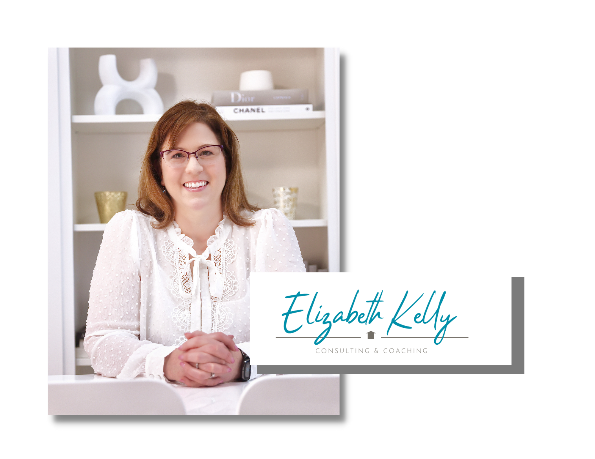 Photo of Elizabeth Kelly - a smiling, white woman wearing a white blouse, sitting at a desk